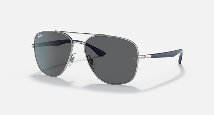 Silver-tone aviator sunglasses with dark gray lenses and dark blue temples.