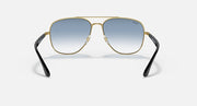 Gold-tone aviator sunglasses with light blue gradient lenses and black arms.