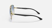 Gold-tone aviator sunglasses with black temples and dark lenses.
