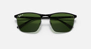 Sunglasses with green mirrored lenses and black frame, top-front view