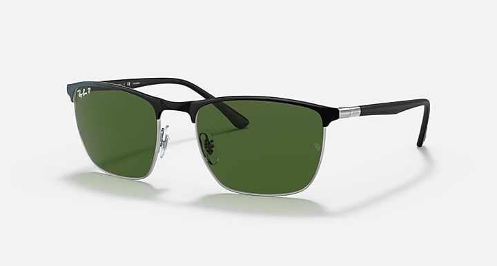Sunglasses with green mirrored lenses and dark frame, metal hinges visible