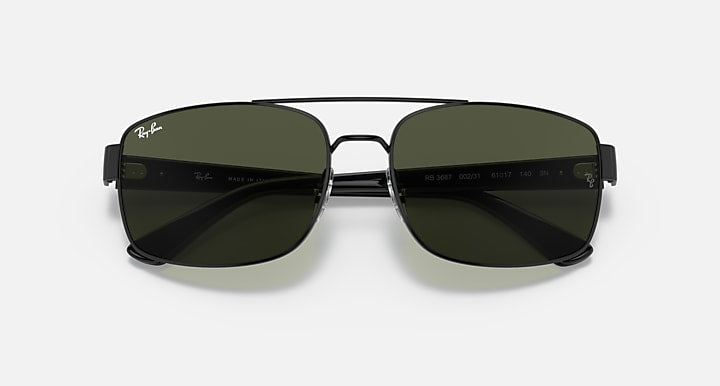 Black sunglasses with dark lenses, rounded rectangular shape, top view of frame.