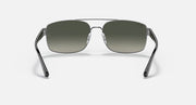 Silver-toned sunglasses with green gradient lenses, front view on a simple background.
