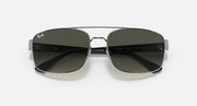 Top view of silver-toned sunglasses with dark tinted lenses and small branding near hinges.