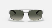 Silver-toned sunglasses with green gradient lenses, front view with bridge detail.