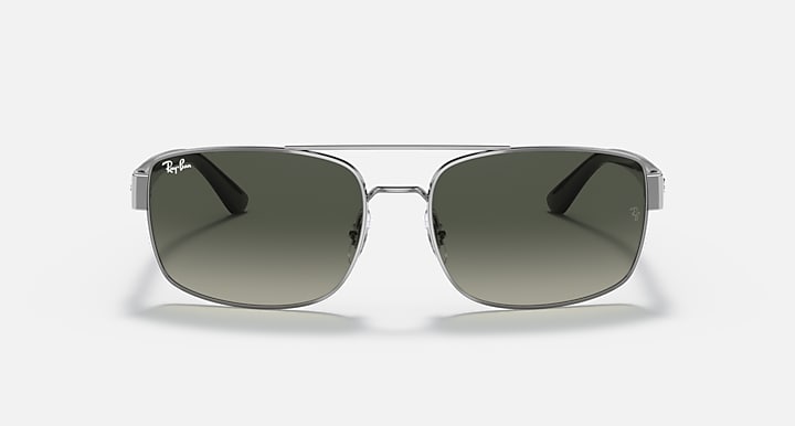 Silver-toned sunglasses with green gradient lenses, front view with bridge detail.