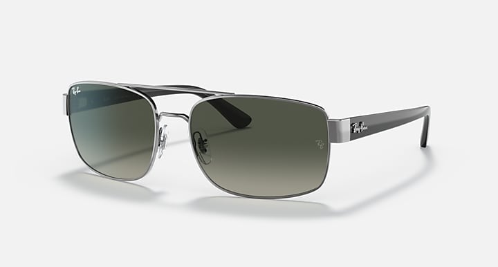 Sunglasses with black frame and green gradient lenses, angled view showing temple tips.