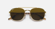 Ray-Ban sunglasses with gold-tone frame and dark brown lenses, front close-up