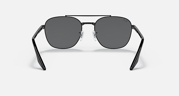 Round sunglasses with dark gray lenses and black metal frame, front-facing angle