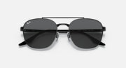 Round sunglasses with dark gray lenses and black frame, angled front view
