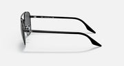 Round sunglasses, black metal frame and dark lenses, side profile with logo detail