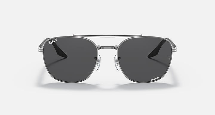 Round sunglasses with dark lenses and black metal frame, 3/4 view from front