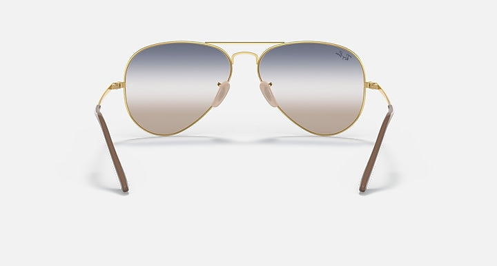 Aviator sunglasses with gradient lenses and gold metal frame, front view