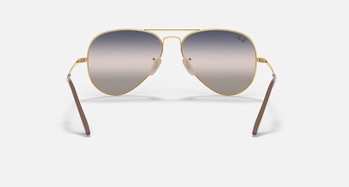 Aviator metal sunglasses with gold frame and dark gradient mirrored lenses