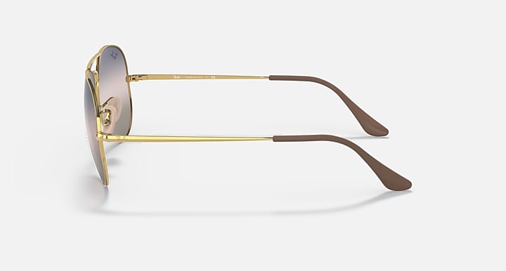 Aviator sunglasses in gold metal with temple detail and mirrored lenses