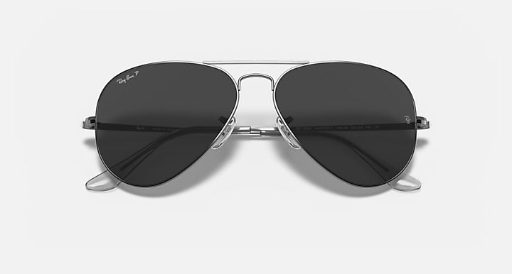 Ray-Ban aviator metal sunglasses with dark lenses and gunmetal frame, center close view