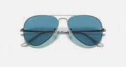 Aviator sunglasses with blue tinted lenses and silver metal frame, bridge bar