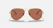 Gold aviator sunglasses with brown tinted lenses, teardrop shape, and bridge detail