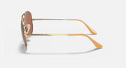 Gold aviator metal sunglasses shown from the side with brown temple tips