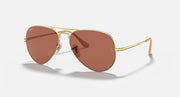 Gold aviator metal sunglasses with brown gradient lenses and thin side arms