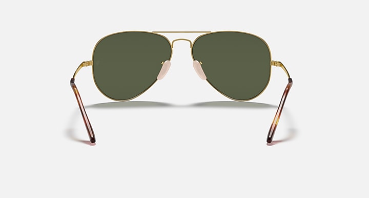 Gold aviator metal sunglasses with dark green lenses and angular temple ends