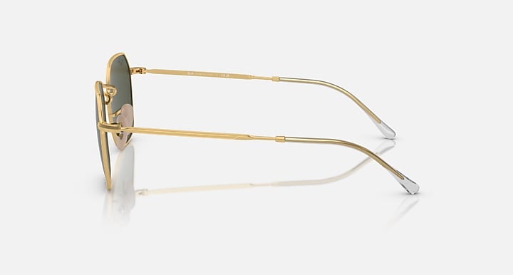 Gold-tone sunglasses side profile with dark lenses and slim metal arms
