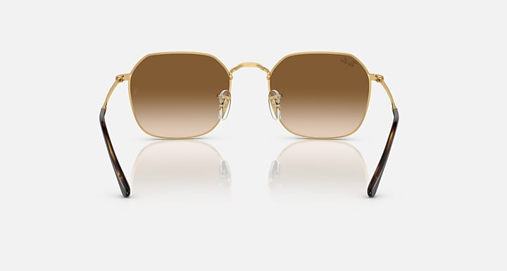Metal sunglasses with gold frame and medium-brown gradient lenses; front view.