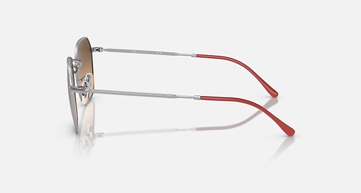 Ray-Ban Jim sunglasses side view with silver metal frame and red temple arms