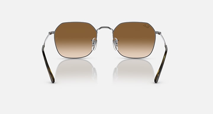 Square sunglasses with silver frame, warm brown lenses, and dark temple arms