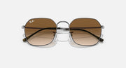 Square sunglasses with silver frame and warm brown lenses with dark top band
