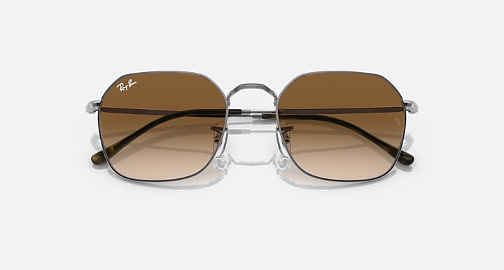 Square sunglasses with silver frame and warm brown lenses with dark top band