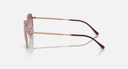 Rose gold sunglasses showing side profile and dark temple tips.