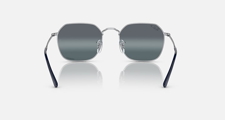 Square sunglasses with dark gray lenses, silver frame, and dark temple arms