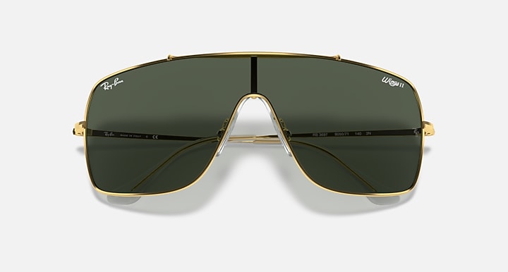 Top view gold-tone sunglasses with dark green lenses and central bridge bar