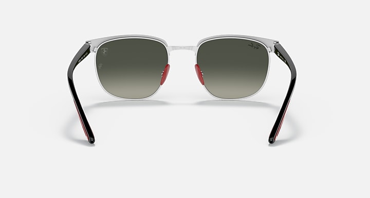 Ray-Ban RB3698M sunglasses with silver frame and dark green lenses