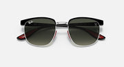 Ray-Ban RB3698M sunglasses with light silver frame and dark green lenses