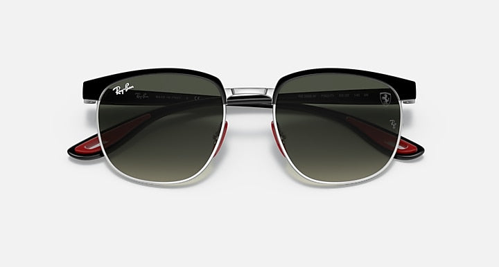 Ray-Ban RB3698M sunglasses with light silver frame and dark green lenses