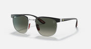 Ray-Ban RB3698M sunglasses with dark frame and green-tinted mirrored lenses