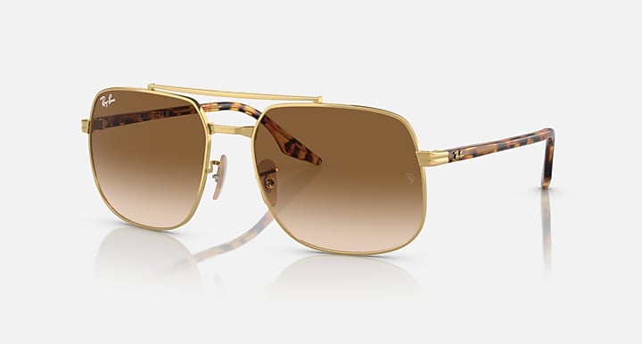 Gold frame square sunglasses with brown gradient lenses and clear temple tips