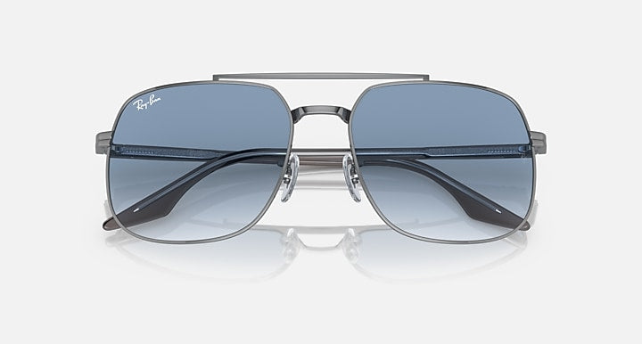 Square sunglasses with silver-tone frame and dark blue gradient lenses