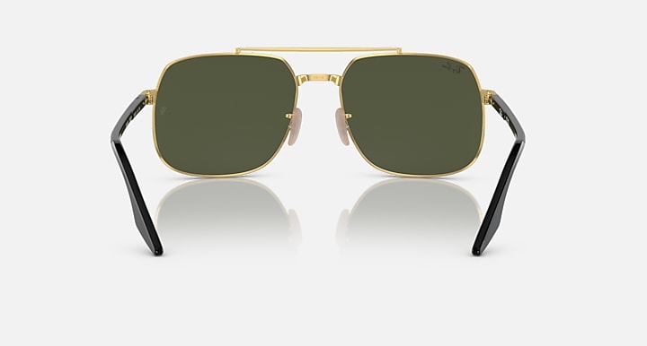 Square sunglasses with dark green lenses, black frame, and gold bridge