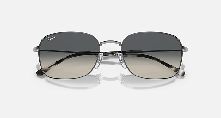 Rectangular sunglasses, dark lenses, tortoiseshell temples, thin metal frame