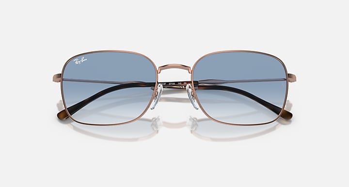 Rectangular sunglasses, rose-gold frame, dark gradient lenses with lighter lower tint