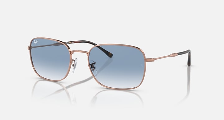 Rectangular sunglasses, rose-gold frame, blue gradient lenses with dark tint