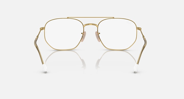 Gold metal sunglasses with clear lenses and rectangular shape, front view.