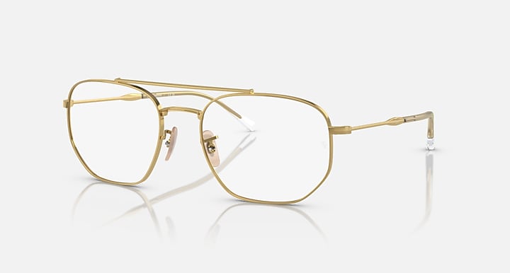 Gold metal frame sunglasses with clear lenses.