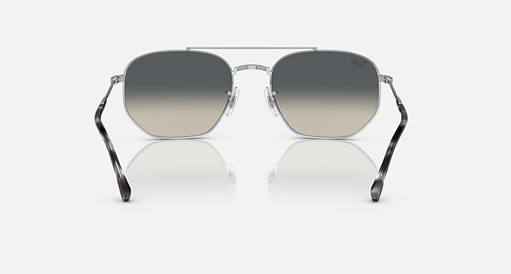 Silver-tone sunglasses with dark grey gradient lenses and patterned side arms