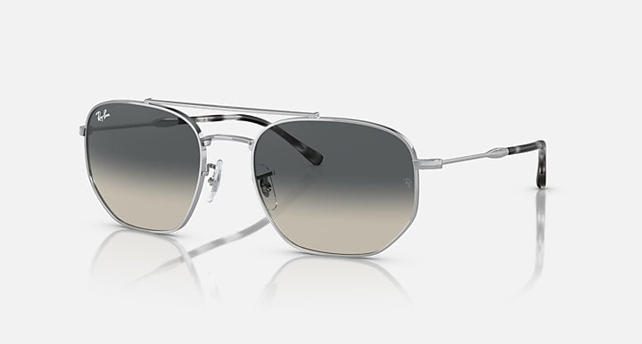 Silver-tone sunglasses with dark grey lenses and clear temple tips