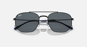 Metal sunglasses with navy accents and dark tinted lenses, front view.