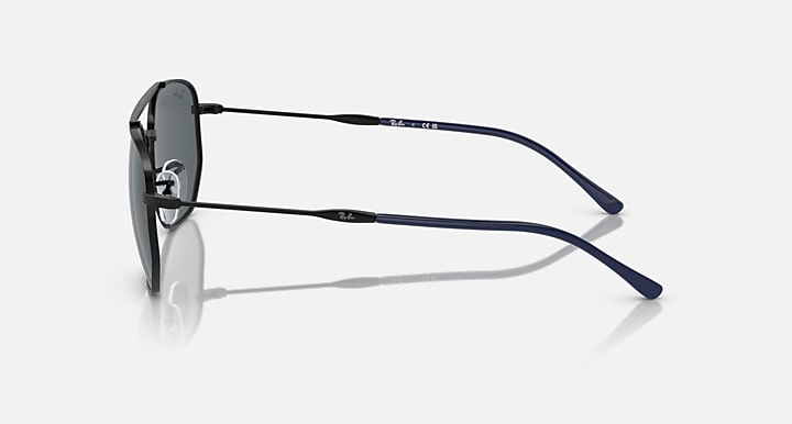 Side view of metal sunglasses with blue temples and dark lenses.